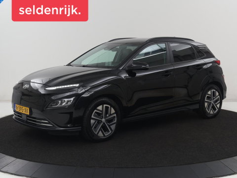 Hyundai KONA EV Premium 64 KWh | SOH 96.2% | Leder | Trekhaak | Head-up | Stoelventilatie | Stuur/stoel verwarming | Adaptive cruise | Camera | Park assist | Carplay | Dodehoek detectie | Krell sound |