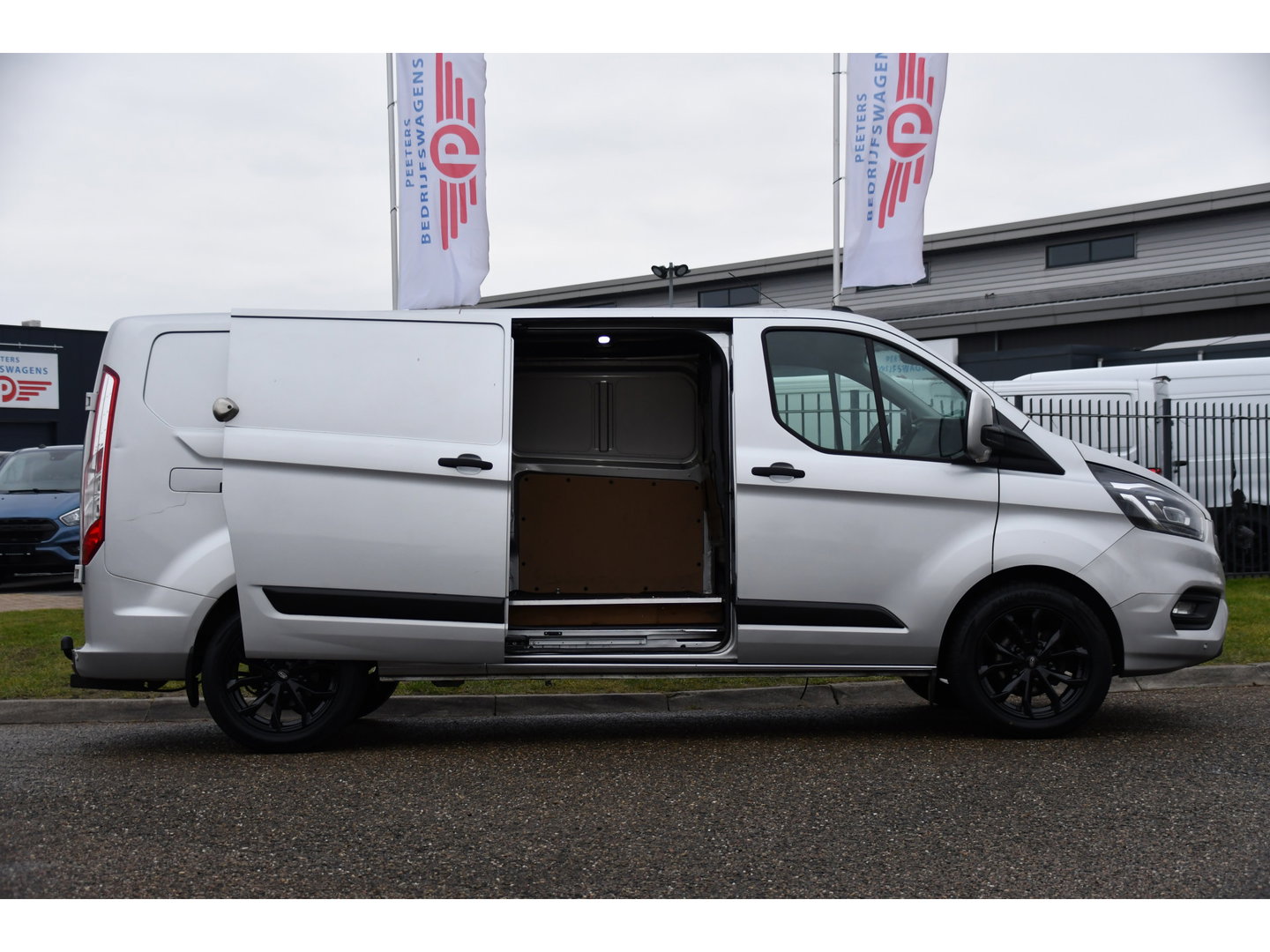 Ford Transit Custom 300 2.0 TDCI L2H1 Raptor Edition Camera, Cruise, Caprlay, Automaat, PDC, Multimedia, Stoelverwarming, Standkachel, Uniek!