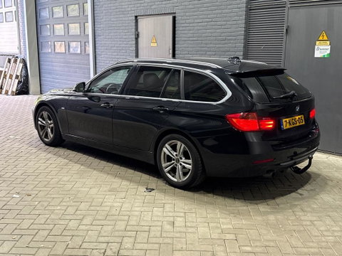 BMW 3 Serie Touring 320i Upgrade Edition | Trekhaak | Leder | Navigatie | PDC | Stoelverwarming