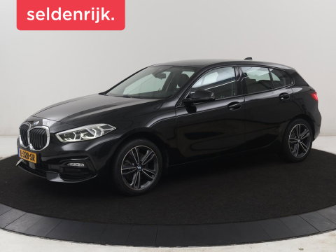 BMW 1-serie 118i Business Edition | Half leder | Cruise control | Stoelverwarming | Navigatie | Carplay | Park assist | Climate control | Virtual dashboard | 17" velgen