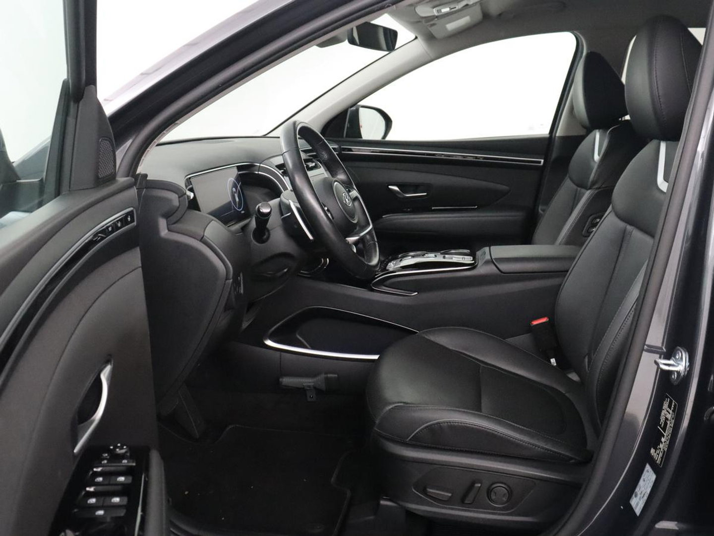 Hyundai Tucson 1.6 T-GDI HEV Premium | Leder | Stoelkoeling | Trekhaak | 360 camera | Adaptive cruise | Carplay | Krell Sound | Memory | Stuur/stoelverwarming |