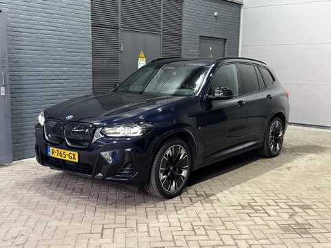 BMW iX3 High Executive 80 kWh | Harman/Kardon | Trekhaak | Head-Up | Parkeerassistent Plus | Adaptief M-onderstel | Stoel+Stuurverwarming | 20 Inch