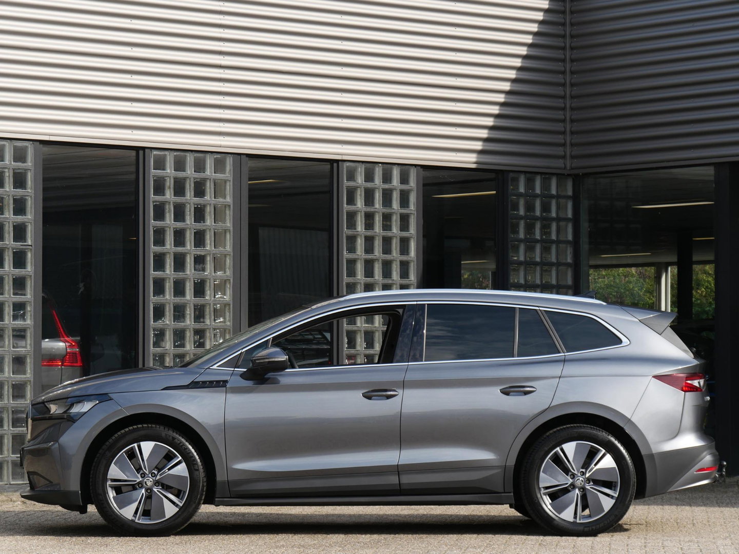 Škoda Enyaq iV 80/ WARMTEPOMP/ LEER/ ADAPTIVE/ TREKHAAK/ HEAD-UP/ SIDE ASSIST/ SOH 95%